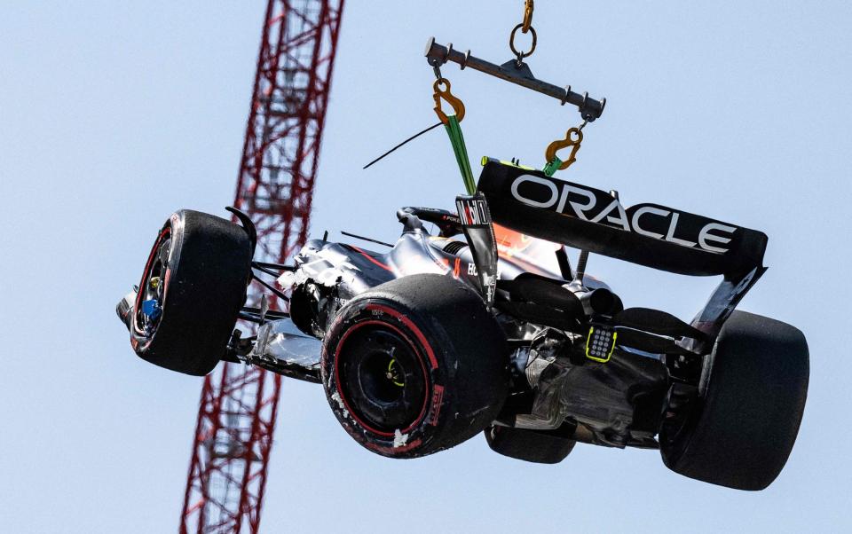 Red Bull Racing's Mexican driver Sergio Perez is removed from the track after he crashed during the qualifying session of the Formula One Monaco Grand Prix at the Monaco street circuit in Monaco, on May 27, 2023 - AFP/Jeff Pachoud