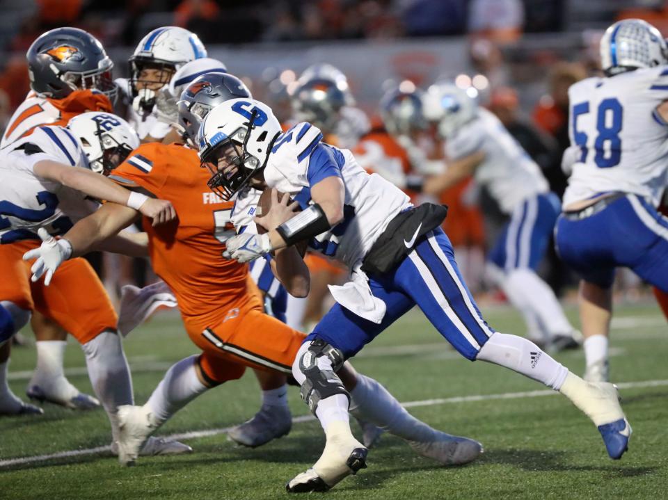 Skyridge quarterback Carson Rasmussen runs with the ball during a 6A quarterfinal football game against Pleasant Grove at Skyridge High School in Lehi on Friday, Nov. 3, 2023. Skyridge won 37-30 in overtime. | Kristin Murphy, Deseret News