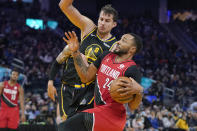 Portland Trail Blazers forward Norman Powell (24) drives to the basket against Golden State Warriors forward Nemanja Bjelica (8) during the first half of an NBA basketball game in San Francisco, Wednesday, Dec. 8, 2021. (AP Photo/Jeff Chiu)