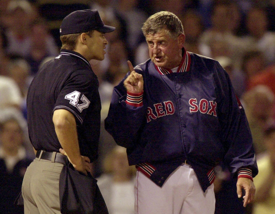 FILE - Boston Red Sox manager Jimy Williams, right, continues to argue with home plate umpire Mark Wegner, left, after being ejected during the fifth inning of a baseball game at Fenway Park in Boston, Thursday May 10, 2001. Jimy Williams, who led Toronto, Boston and Houston to 910 wins over 12 seasons as a major league manager, has died. He was 80. (AP Photo/Charles Krupa, File)