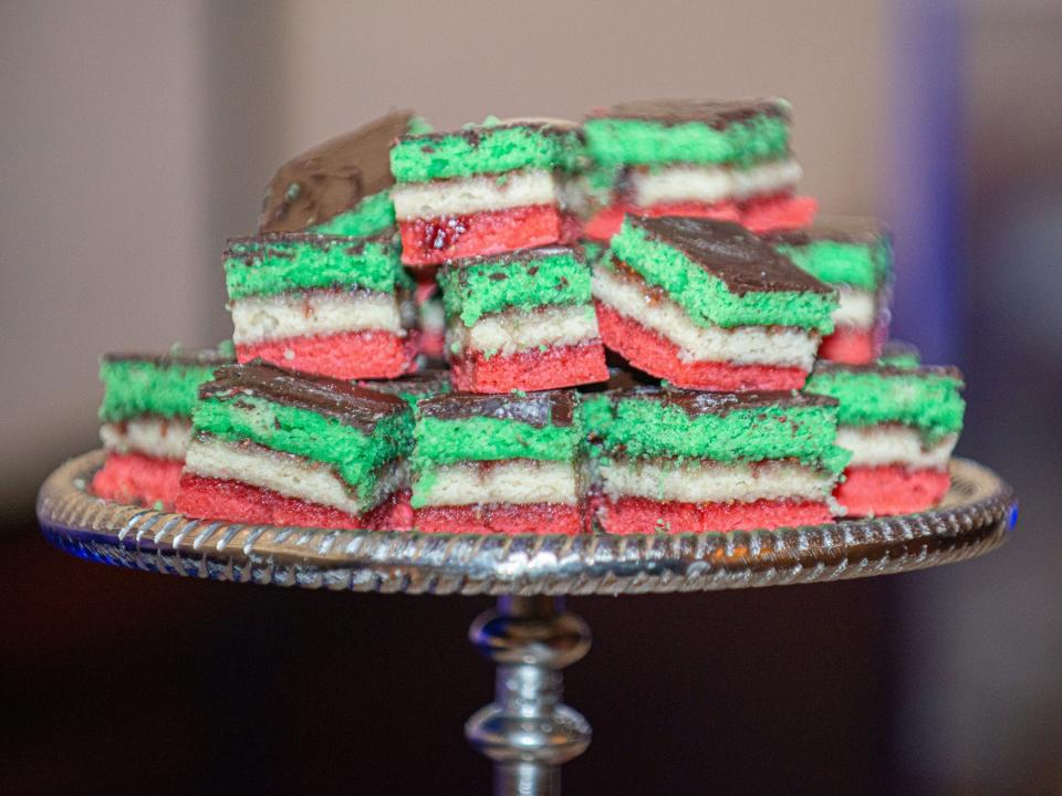 Italian rainbow cookies on a silver tray