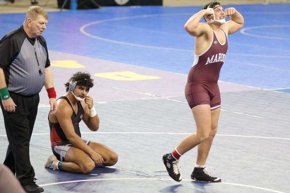 Kolby Looper of Blackwell celebrates beside Easton Malone of Barnsdall after winning a Class 3A 215-pound semifinal match during the Oklahoma state wrestling tournament at State Fair Arena in Oklahoma City, Friday, Feb. 24, 2023.