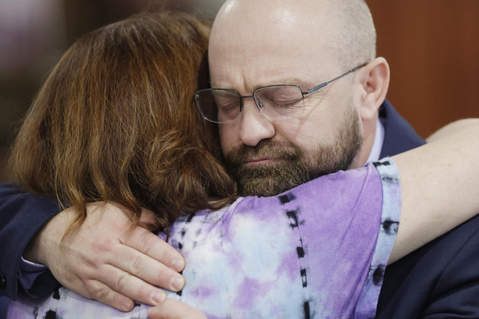 Prosecuting attorney Rob Wood gets a hug after the jury's verdict in the Lori Vallow Daybell murder trial was read at the Ada County Courthouse in Boise, Idaho, Friday, May 12, 2023. Vallow Daybell was found guilty on all counts. (AP Photo/Kyle Green)