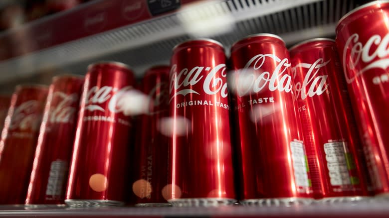 Coca-Cola cans in refrigerator
