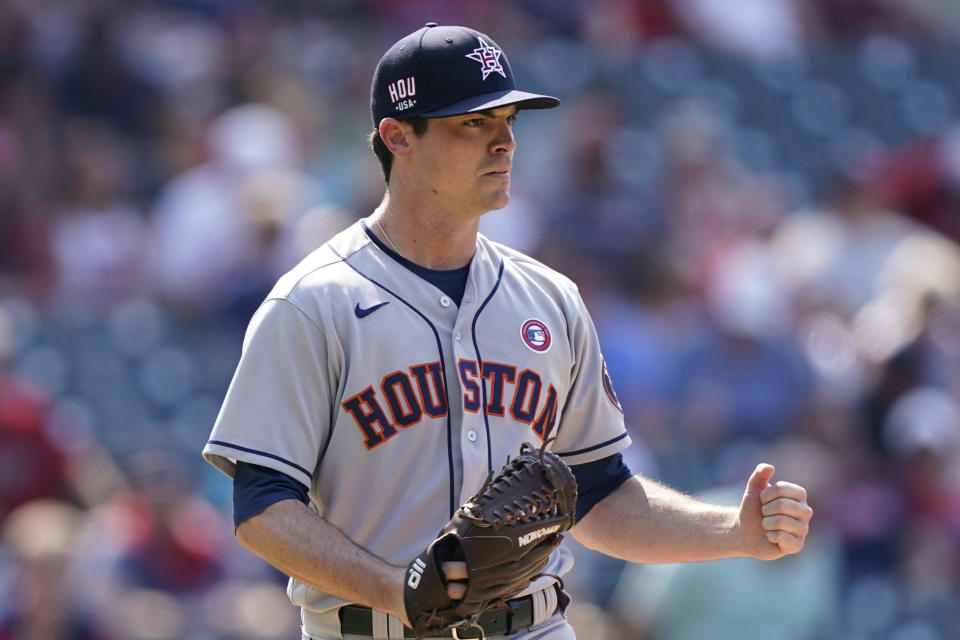 Houston Astros relief pitcher Brooks Raley pumps his fist after his team defeated the Cleveland Indian in 10 innings of a baseball game, Sunday, July 4, 2021, in Cleveland. (AP Photo/Tony Dejak)