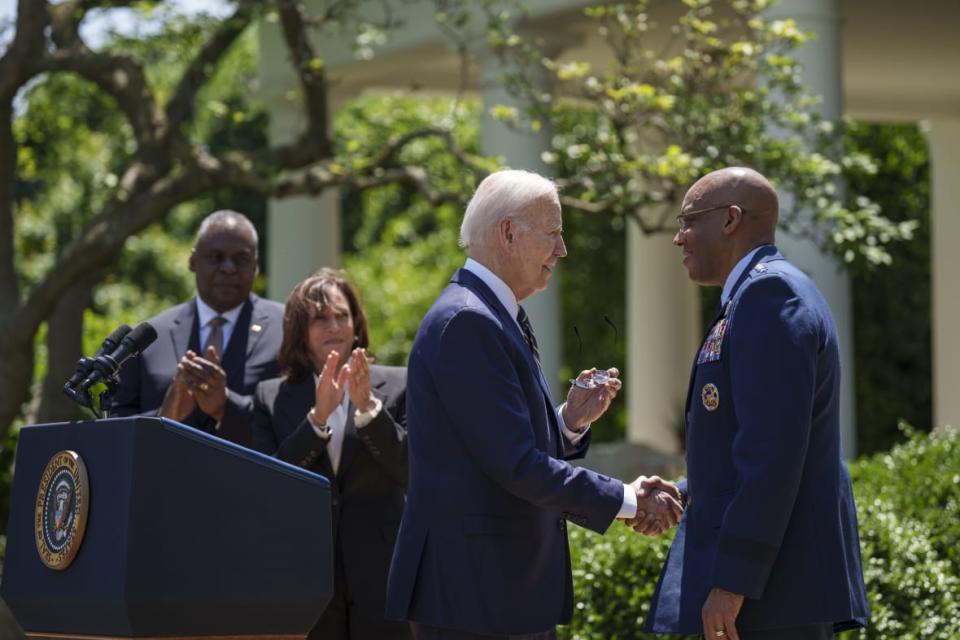 U.S. President Joe Biden shakes hands with Gen. Charles Q. Brown, Jr., Biden’s nominee to serve as the next Chairman of the Joint Chiefs of Staff, during an event in the Rose Garden of the White House May 25, 2023, in Washington, D.C. Applauding at left are Secretary of Defense Lloyd Austin and Vice President Kamala Harris. (Photo by Drew Angerer/Getty Images)