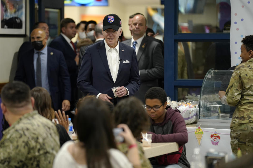 U.S. President Joe Biden, center, meets with American service members and their family at Osan Air Base, Sunday, May 22, 2022, in Pyeongtaek, South Korea. (AP Photo/Evan Vucci)