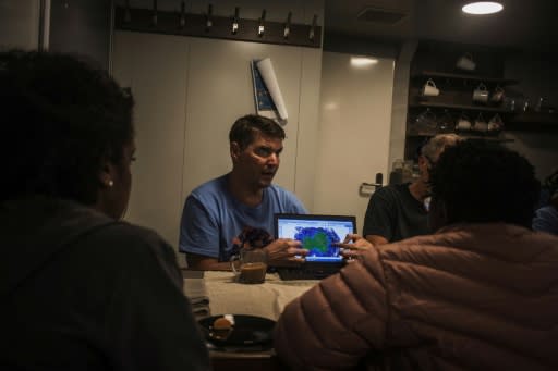 Marine biologist Thilo Maack briefs the Greenpeace team about the Vema Seamount. The area seems to be recovering from overfishing, but like seas everywhere is being hit by global warming