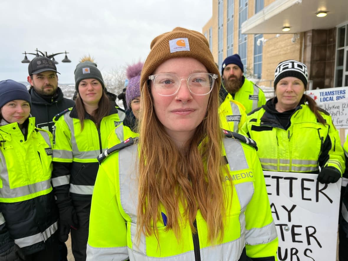 Emily White, a paramedic for one of seven companies owned by Bob Fewer, and her colleagues were at Confederation Building on Monday, as elected officials debated a bill to send them back to work with more regulations to help continue negotiations. (Terry Roberts/CBC - image credit)