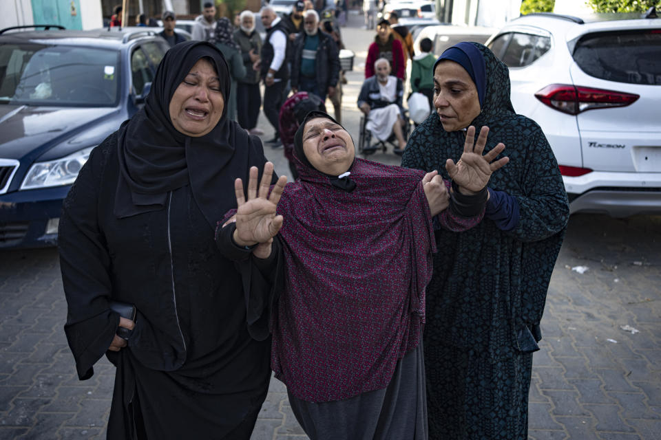 Palestinians mourn their relatives killed in the Israeli bombardment of the Gaza Strip, in the hospital in Khan Younis, Saturday, Dec. 2, 2023. (AP Photo/Fatima Shbair)