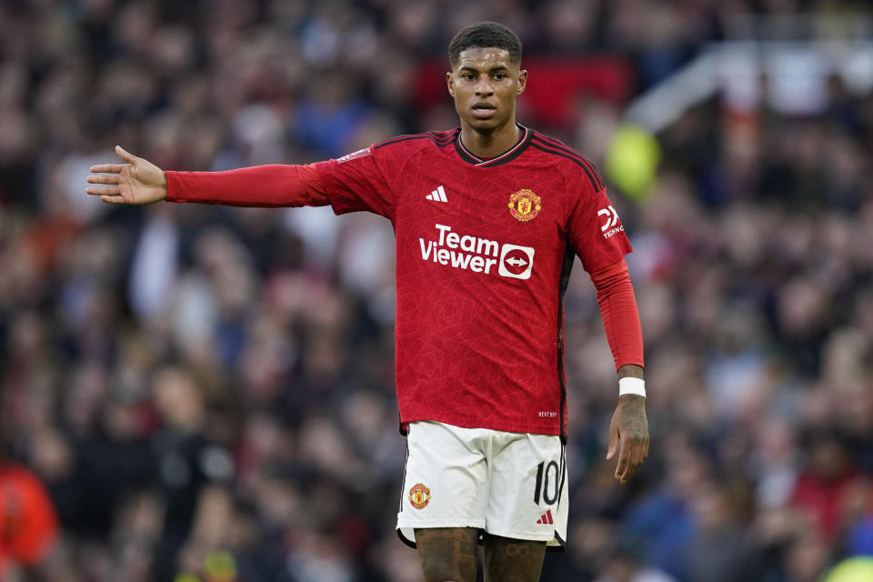 FILE - Manchester United's Marcus Rashford gestures during the FA Cup quarterfinal soccer match between Manchester United and Liverpool at the Old Trafford stadium in Manchester, England, Sunday, March 17, 2024. The most feared striker in Europe won’t be playing at the European Championship. That’s because Erling Haaland’s Norway didn’t qualify. Other big names missing from the Euros include Karim Benzema, Marcus Rashford, Mats Hummels and Sandro Tonali. (AP Photo/Dave Thompson, File)