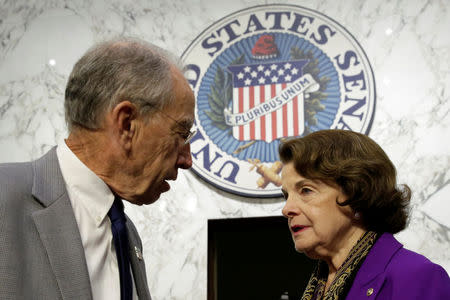 Senate Judiciary Committee Chairman Charles Grassley (R-IA) (L) and Sen. Dianne Feinstein (D-CA) speak before a continuation of Senate Judiciary Committee hearing on alleged Russian meddling in the 2016 presidential election on Capitol Hill in Washington, U.S., July 27, 2017. REUTERS/Yuri Gripas