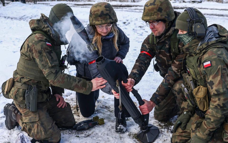 Civilians and soldiers at a 'Train With The Army' military programme run by 16th Airborne Battalion in Krakow in February - NurPhoto