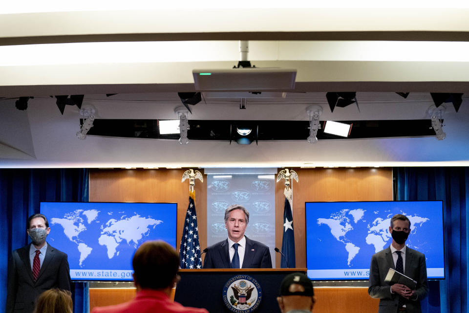 Secretary of State Antony Blinken, center, accompanied by International Religious Freedom Senior Official Dan Nadel, left, and State Department spokesman Ned Price, right, speaks at a news conference to announce the annual International Religious Freedom Report at the State Department in Washington, Wednesday, May 12, 2021. (AP Photo/Andrew Harnik, Pool)