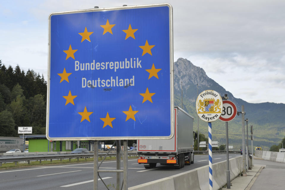 FILE - In this Tuesday Sept. 15, 2015 file photo a truck passes the border from Austria to Germany at the border crossing Salzburg Walserberg, in Salzburg, Austria. Germany's population has contracted slightly for the first time in nearly a decade because immigration shrank as a result of the coronavirus pandemic, official data showed Tuesday. (AP Photo/Kerstin Joensson, file)