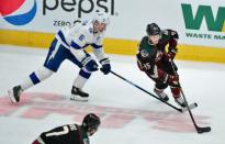 Oct 27, 2018; Glendale, AZ, USA; Arizona Coyotes right wing Josh Archibald (45) carries the puck as Tampa Bay Lightning defenseman Anton Stralman (6) defends during the first period at Gila River Arena. Mandatory Credit: Matt Kartozian-USA TODAY Sports