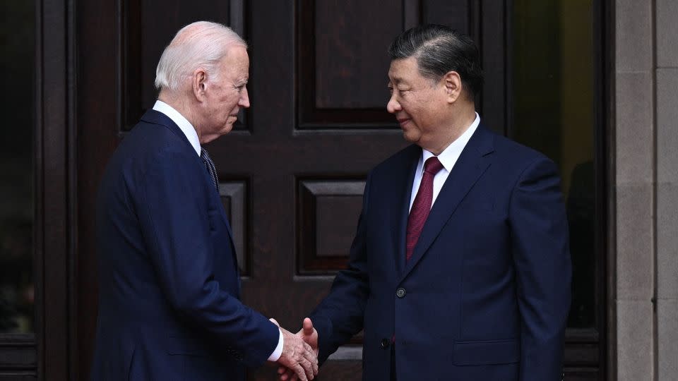 US President Joe Biden greets Chinese leader Xi Jinping before a bilateral meeting in Woodside, California on Wednesday. - Brendan Smialowski/AFP/Getty Images