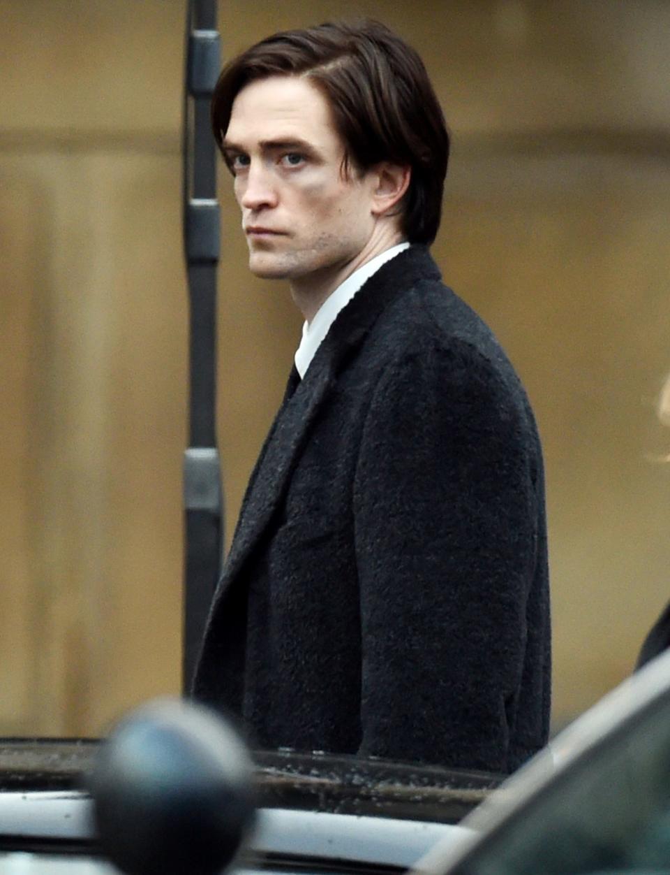 <p>Robert Pattinson is seen in character while filming<i> Batman</i> in Liverpool on Wednesday. </p>