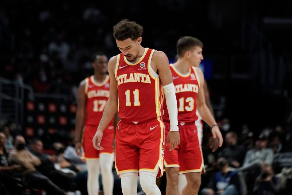 Atlanta's Trae Young (11), Onyeka Okongwu (17) and Bogdan Bogdanovic (13)