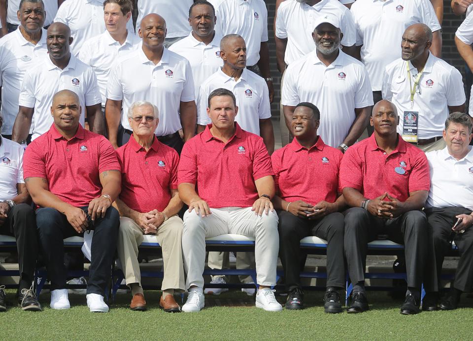 Pro Football Hall of Fame class of 2022 enshrinees pose for a group photo in Centennial Plaza downtown Canton Friday, August 5, 2022.