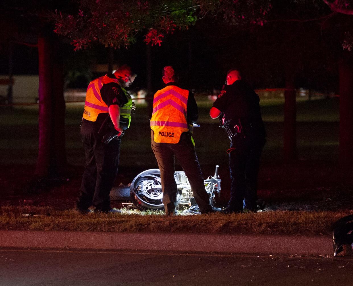 A fatal motorcycle crash scene, at which a man and woman were killed when the motorcycle they were riding crashed into a tree.