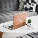 <p>Protect his laptop in style with this <strong>wooden cover by WoodWe. </strong> The slim design, will allow the device to easilt fit in any sleeve/briefcase. Available in a variety of different finishes, WoodWe’s computer covers is something your dad doesn’t know he needs. Price: $110 </p>