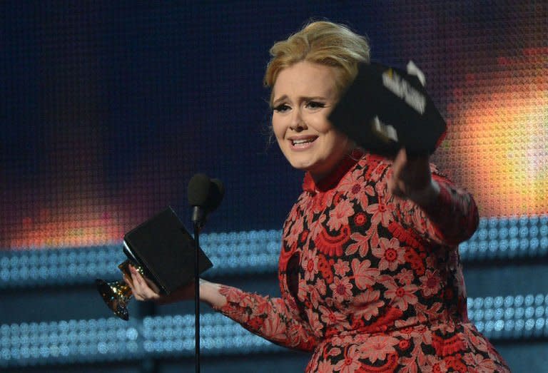 Adele receives the Grammy for best pop solo performance during the 55th Grammy Awards in Los Angeles, California, February 10, 2013