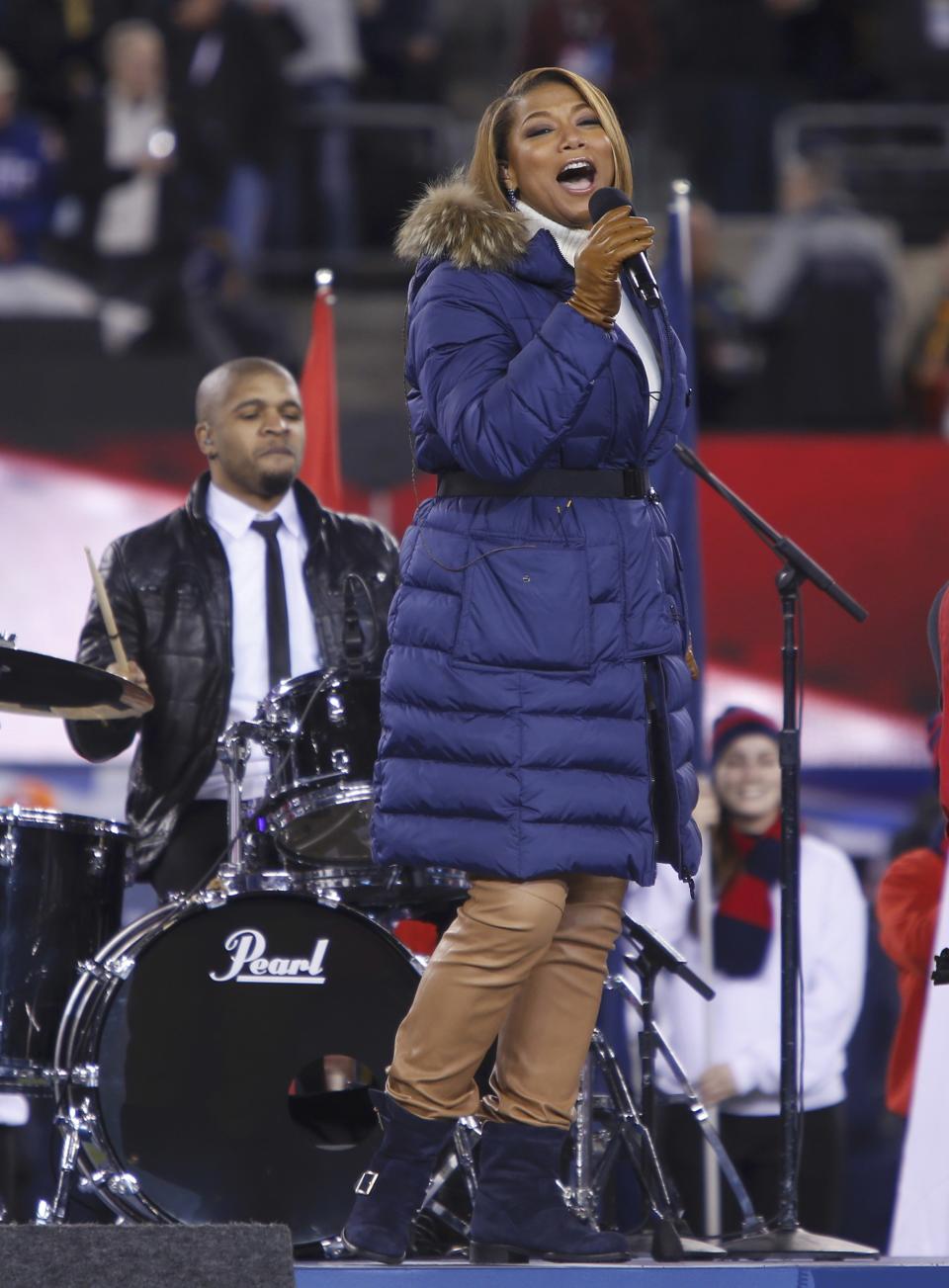 Singer Queen Latifah performs "America the Beautiful" prior to the start of the NFL Super Bowl XLVIII football game in East Rutherford