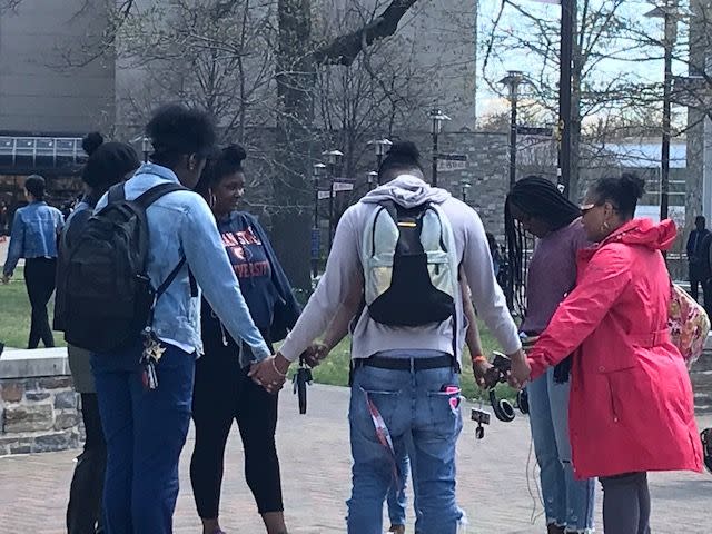 Students at Morgan State University gather for a prayer circle April 10, 2019 on The Quad on campus.