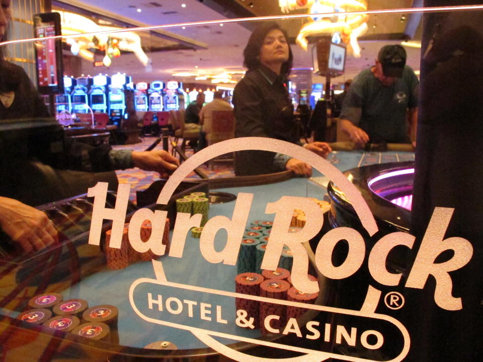 FILE - In this June 20, 2019 file photo, a roulette dealer waits for bets to be placed at the Hard Rock casino in Atlantic City, N.J. Hard Rock is canceling live entertainment at all its U.S. properties for 30 days in response to the coronavirus outbreak, one of many steps casinos around the country are taking in response to the outbreak. (AP Photo/Wayne Parry)