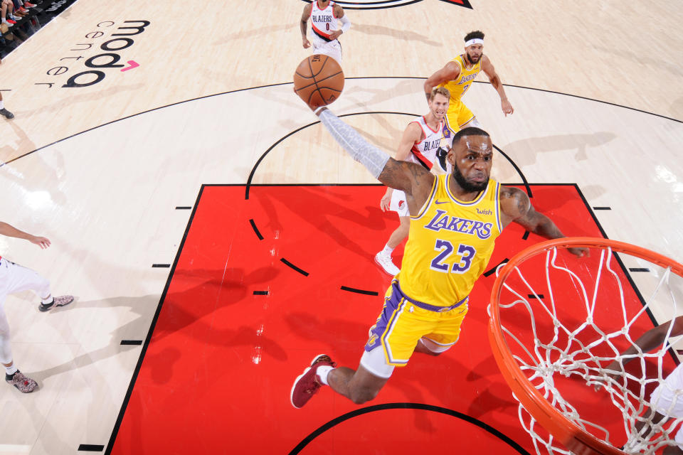 LeBron James slams it home Thursday night in his Lakers debut against the Trail Blazers. (Getty)