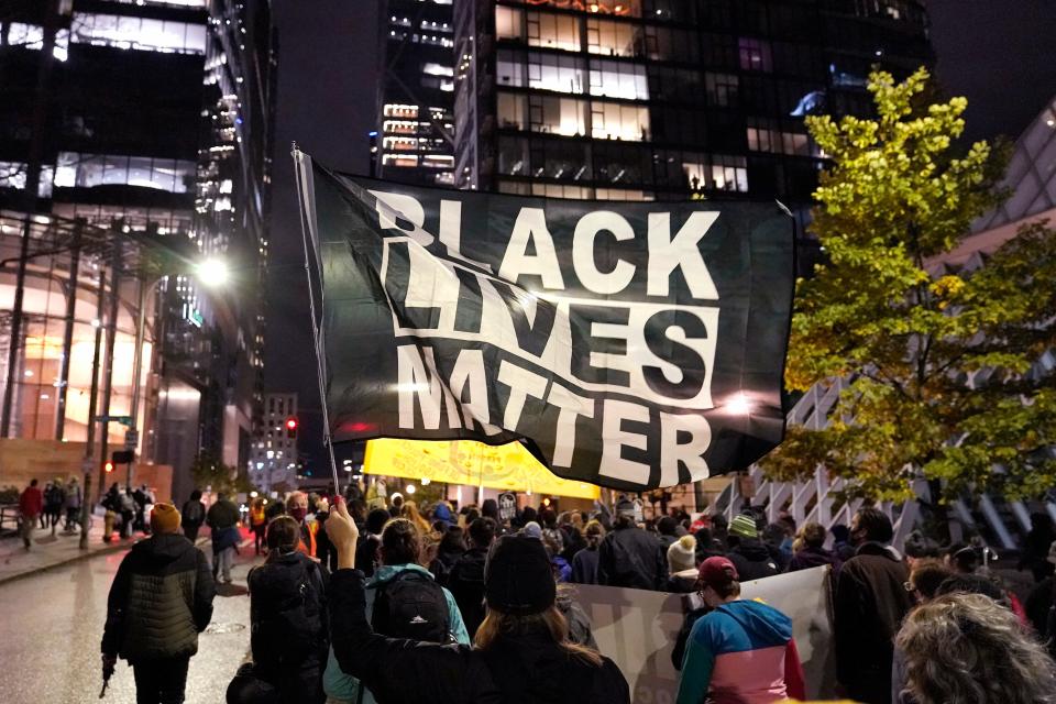 Protesters representing Black Lives Matter and Protect the Results march Wednesday evening, Nov. 4, 2020, in Seattle.