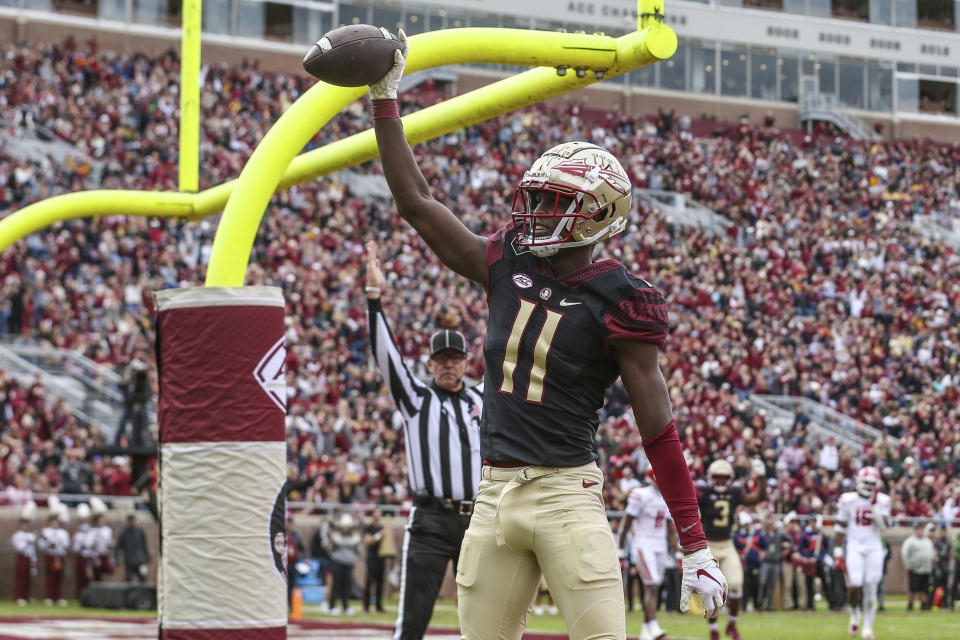 Florida State wide receiver Malik McClain (11) celebrates his touchdown during the first half of an NCAA college football game against Louisiana on Saturday, Nov. 19, 2022, in Tallahassee, Fla. (AP Photo/Gary McCullough)