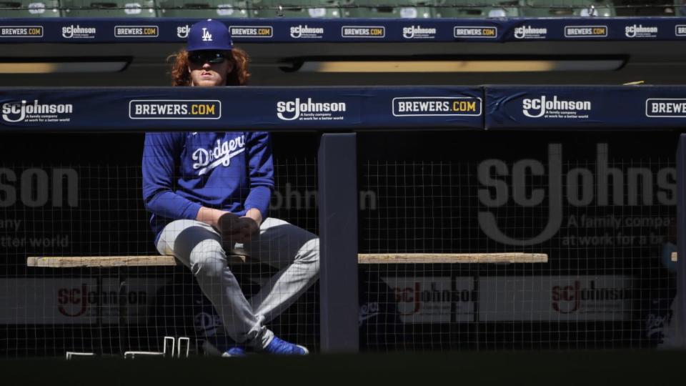 The Dodgers&#39; Dustin May watches a game from the dugout last season