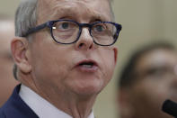 FILE - In this Feb. 27, 2020, file photo, Ohio Gov. Mike DeWine gives an update on COVID-19 at MetroHealth Medical Center in Cleveland. DeWine has accepted a White House proposal for Ohio unemployment claimants to receive $300 in weekly unemployment compensation assistance with no state money involved. (AP Photo/Tony Dejak, File)