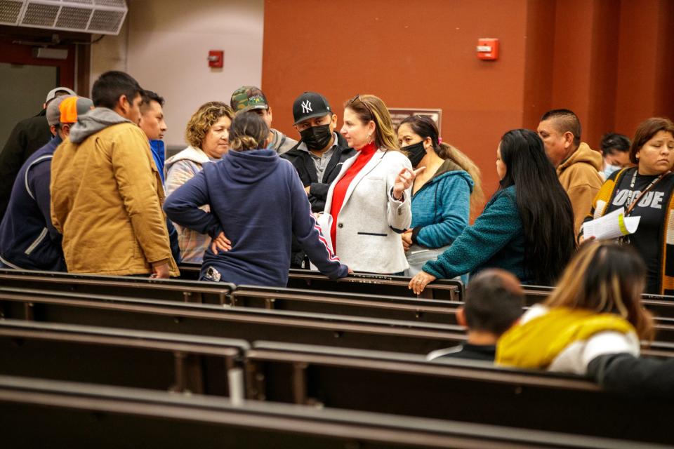 Oasis Mobile Home Park residents listen to Riverside County Department of Housing Director Heidi Marshall at Oasis Elementary School on Feb. 1.