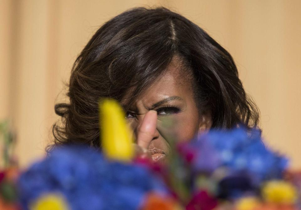 U.S. First Lady Michelle Obama gives a thumbs up as she takes her seat at the White House Correspondents' Association Dinner in Washington May 3, 2014. REUTERS/Joshua Roberts