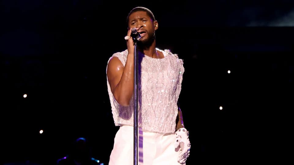 Usher performs in a crystal-encrusted D&G vest. - Kevin Mazur/Getty Images