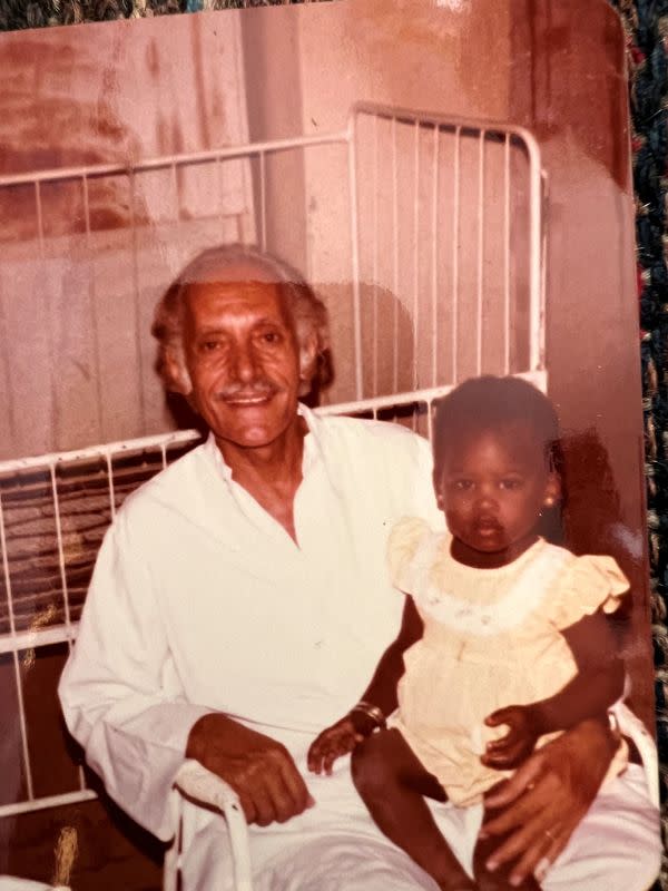An undated handout image shows Kholoud Yagoob Abdallah when she was a toddler with her adopted family member in Khartoum An undated handout image shows a Sudanese woman trapped in Khartoum