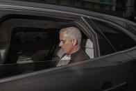 Manchester United former manager Jose Mourinho leaves the Lowry Hotel in Manchester, England, Tuesday, Dec. 18, 2018. Jose Mourinho was fired by Manchester United on Tuesday after failing to restore its status as a major European force in a turbulent 2½-year spell marked by clashes with players and increasing disgruntlement at the team's style of play. (AP Photo/Jon Super)