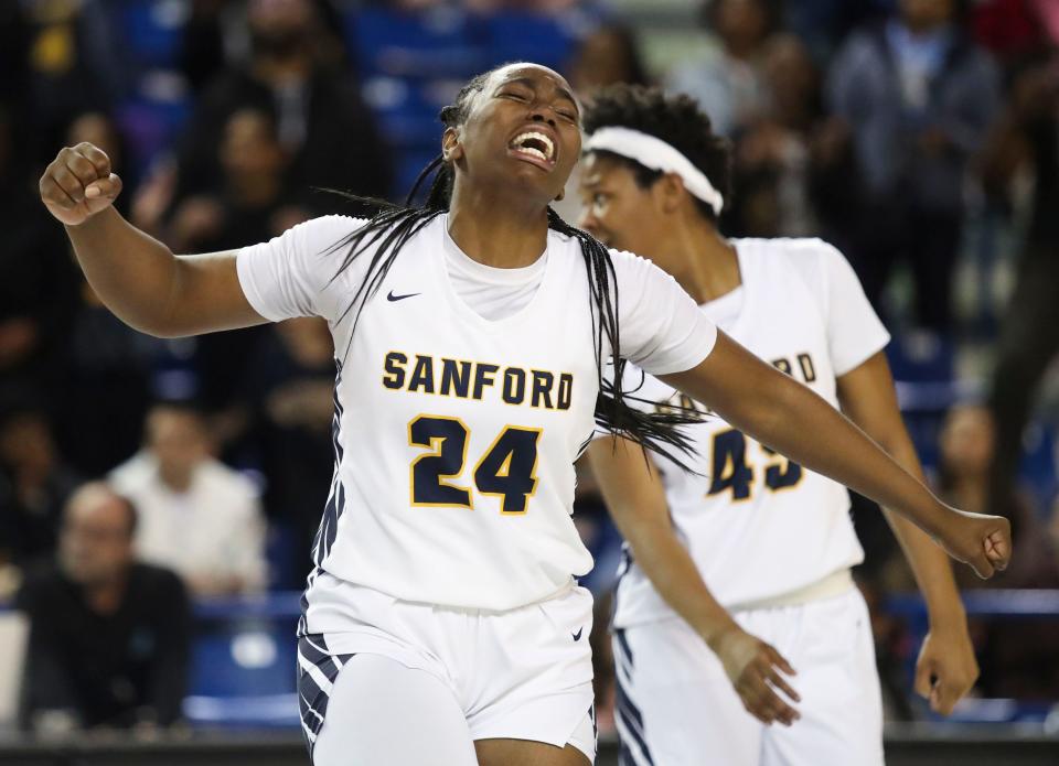 Sanford's Dallas Pierce enjoys the final moments of the Warriors' 58-46 win against Ursuline in the DIAA state tournament championship game at the Bob Carpenter Center, Friday, March 10, 2023.