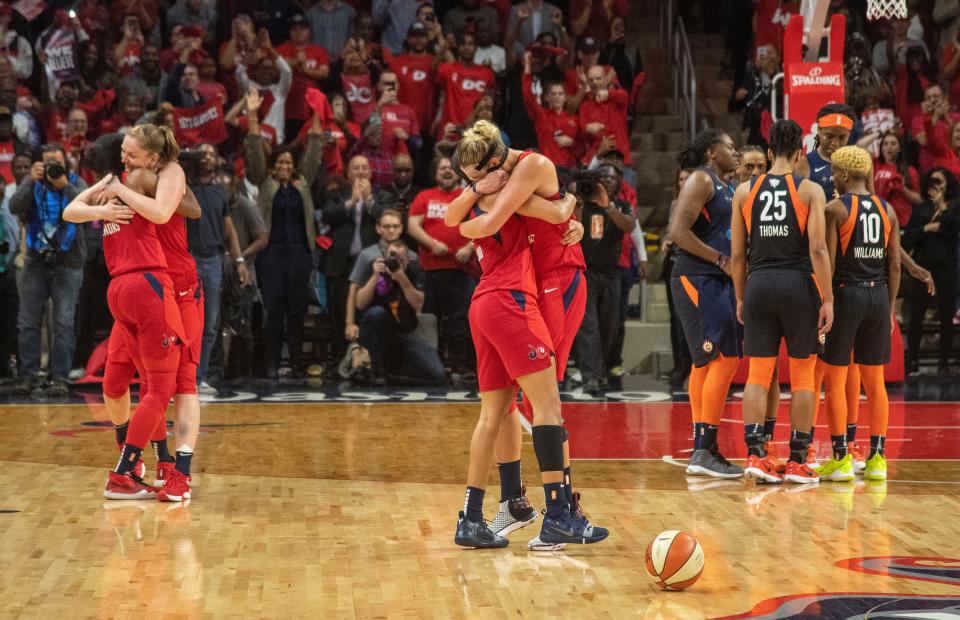 Ellena Delle Donne, right, and Natasha Cloud celebrate the Mystics' first WNBA championship in franchise history.