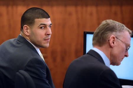 Former New England Patriots football player Aaron Hernandez sits with defense attorney Charles Rankin during his murder trial at Bristol County Superior Court in Fall River, Massachusetts, March 6, 2015. REUTERS/Ted Fitzgerald/Pool