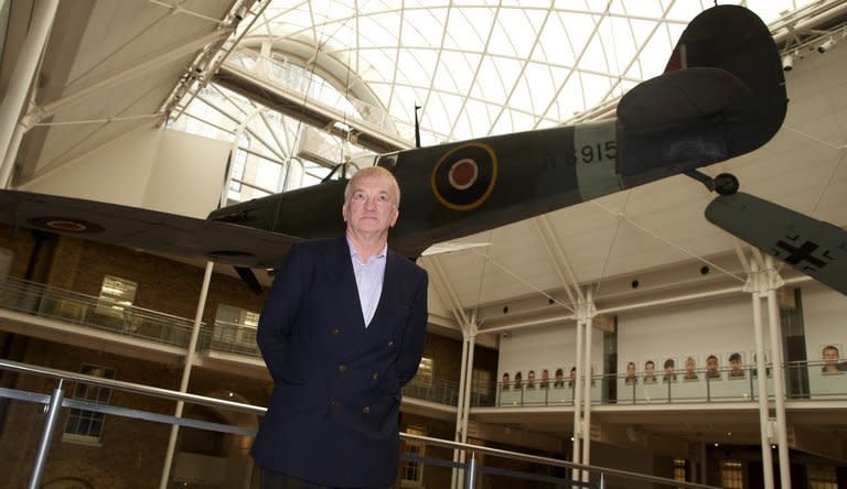 Project leader David Cundall stands in front of a Spitfire at the Imperial War Museum in London on November 28, 2012. The excavation team hunting for World War II-era Spitfires in Myanmar said Wednesday they were confident about recovering the planes after finding a crate buried in the ground