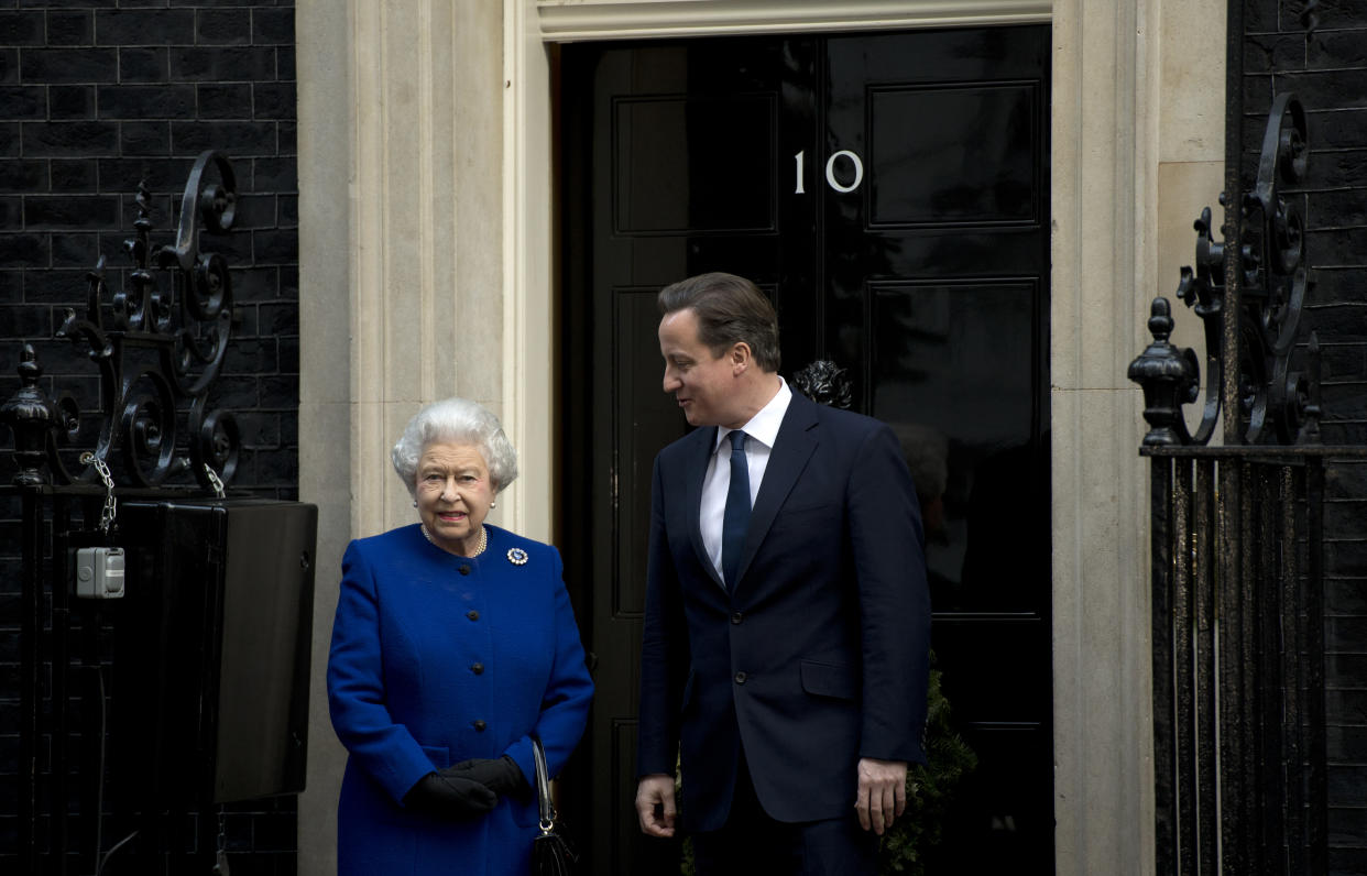 Britain's Prime Minister David Cameron (R) greets Queen Elizabeth II (L) outside No 10 Downing Street in London December 18, 2012 as she arrives to attend the meeting of the Cabinet. Queen Elizabeth II attended her first-ever cabinet meeting on Tuesday to mark her diamond jubilee, the only monarch to do so since 1781.The 86-year-old sovereign sat in as an observer on the meeting and received a gift from the Cabinet to celebrate her 60 years on the throne. AFP PHOTO / ADRIAN DENNIS        (Photo credit should read ADRIAN DENNIS/AFP via Getty Images)