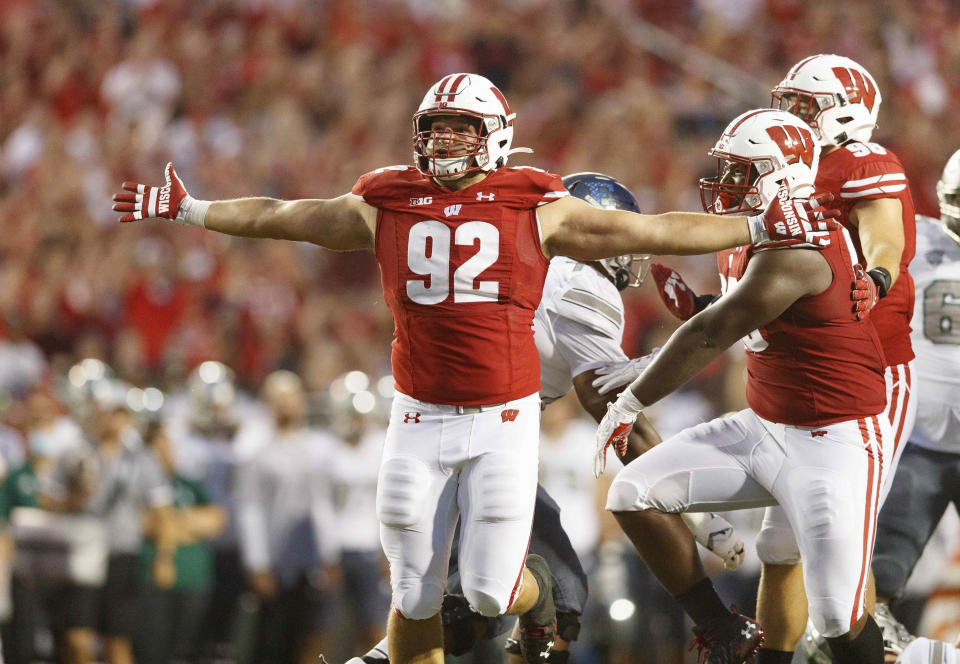 Sept. 11, 2021; Madison; Wisconsin Badgers defensive end Matt Henningsen (92) celebrates after sacking Eastern Michigan Eagles quarterback Ben Bryant (8) (not pictured) during the second quarter at Camp Randall Stadium. Jeff Hanisch-USA TODAY Sports