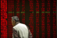 A Chinese investor monitors stock prices at a brokerage house in Beijing Friday, Sept. 28, 2018. Asian markets rebounded on Friday as strong U.S. economic data supported the Federal Reserve's decision to raise interest rates. (AP Photo/Mark Schiefelbein)