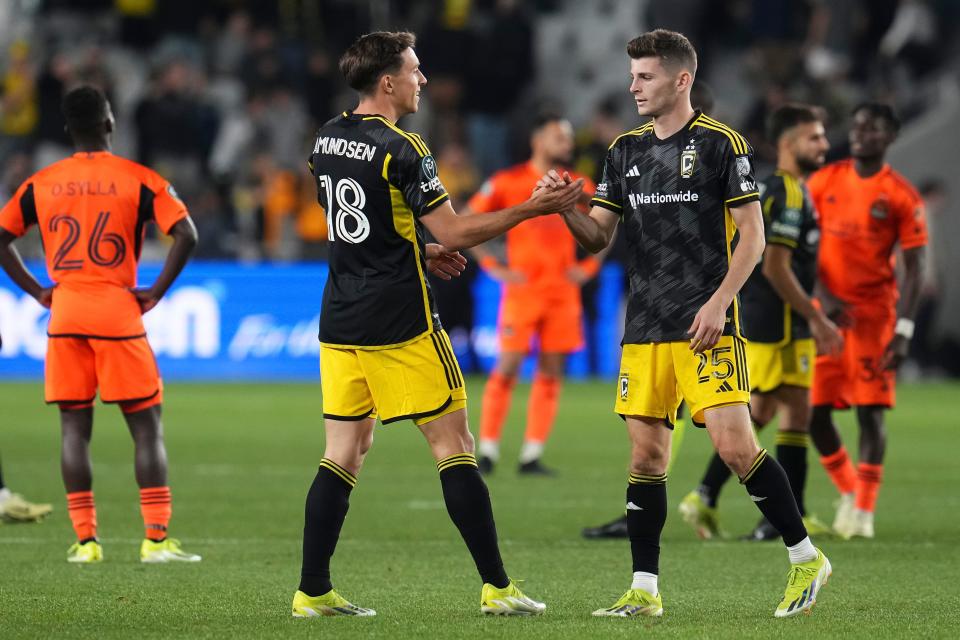 Mar 12, 2024; Columbus, OH, USA; Columbus Crew defender Malte Amundsen (18) celebrates the win with midfielder Sean Zawadzki (25) following the Concacaf Champions Cup soccer game against the Houston Dynamo at Lower.com Field. Mandatory Credit: Adam Cairns-USA TODAY Sports