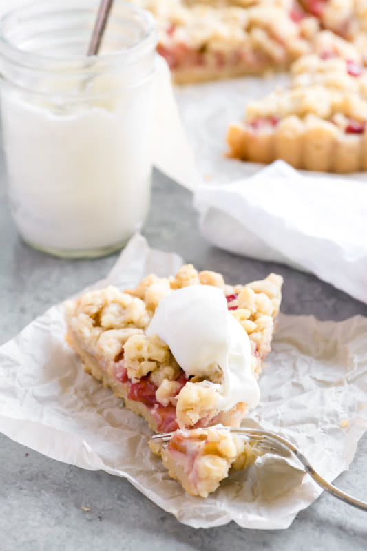 <p><strong>Rhubarb Shortbread Crumble Tart</strong></p><p>Get the recipe <a href="https://theviewfromgreatisland.com/rhubarb-shortbread-crumble-tart-recipe/" rel="nofollow noopener" target="_blank" data-ylk="slk:here;elm:context_link;itc:0;sec:content-canvas" class="link "><em><strong>here</strong></em></a></p>