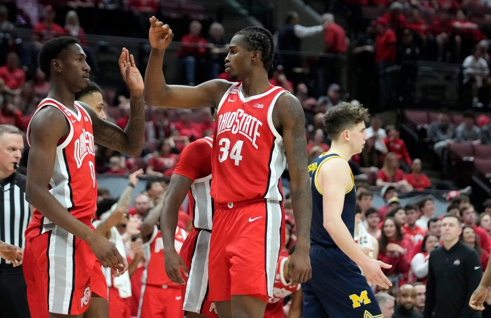 Ohio State's Scotty Middleton (0) and Felix Okpara (34) high-five after a foul on Michigan on March 3.
